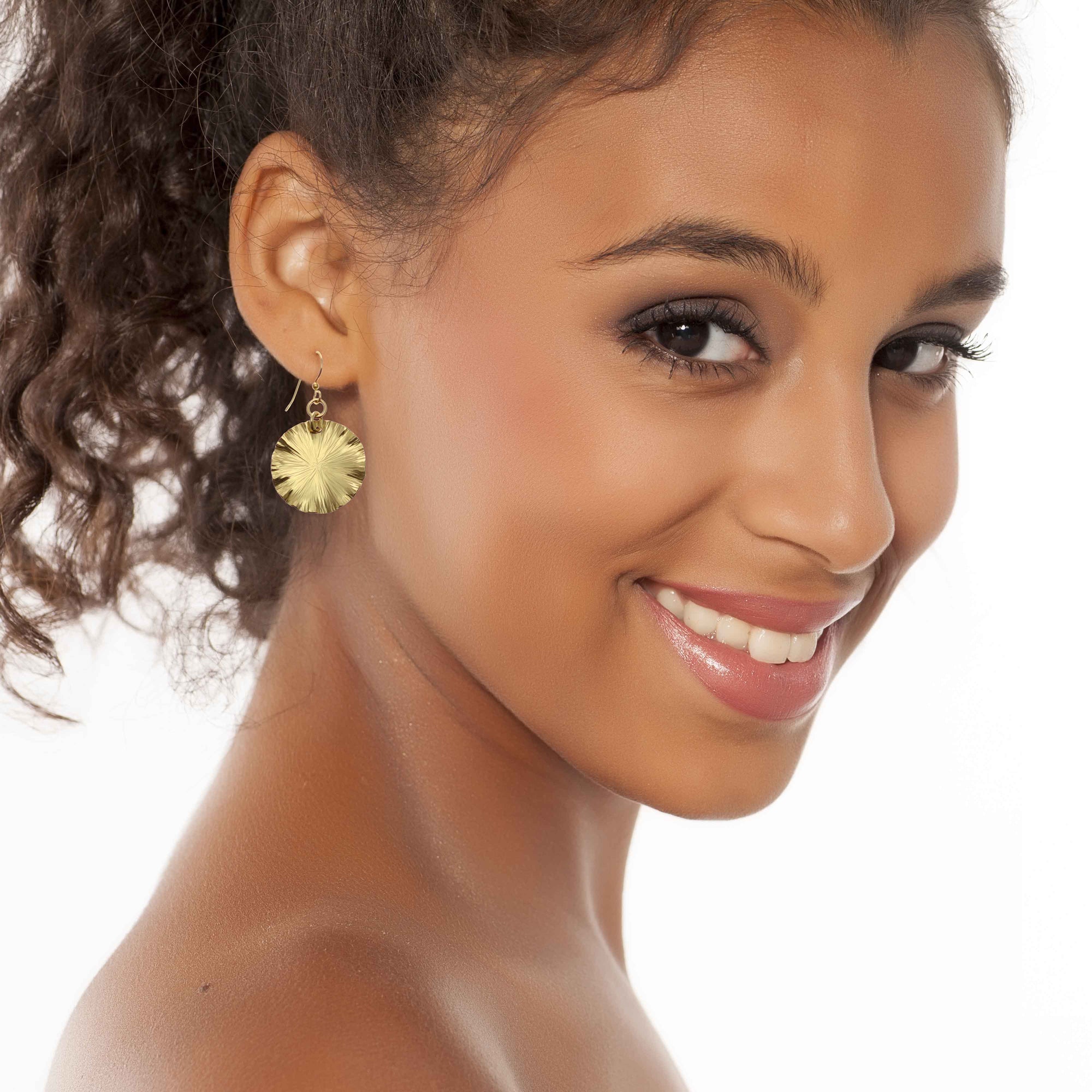 Smiling Woman Wearing Small Nu Gold Brass Lily Pad Leaf Earrings