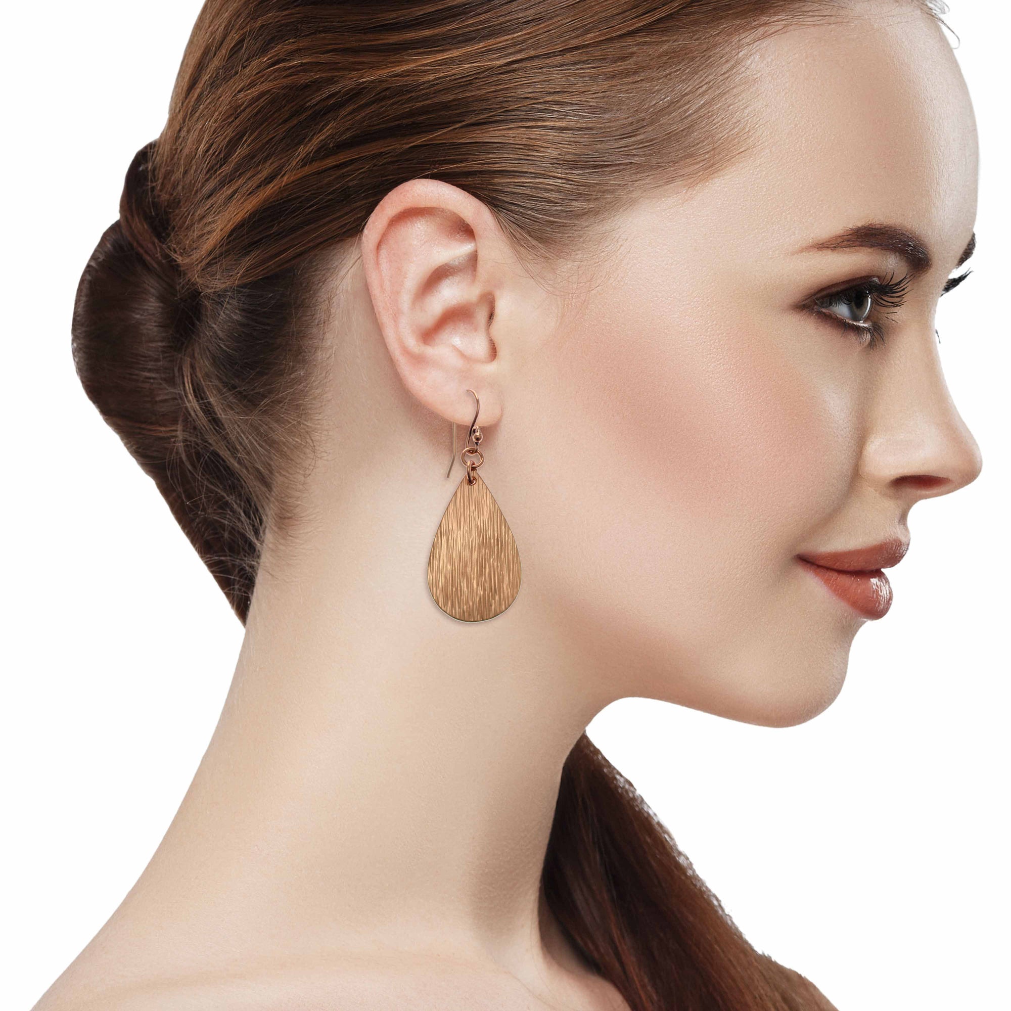 Stunning Woman Wearing Bark Embossed Small Teardrop Earrings