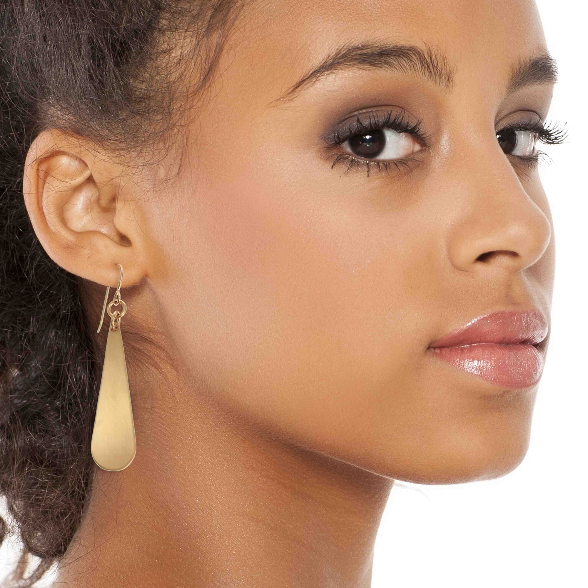 Chic Woman Wearing Brushed Bronze Long Teardrop Earrings