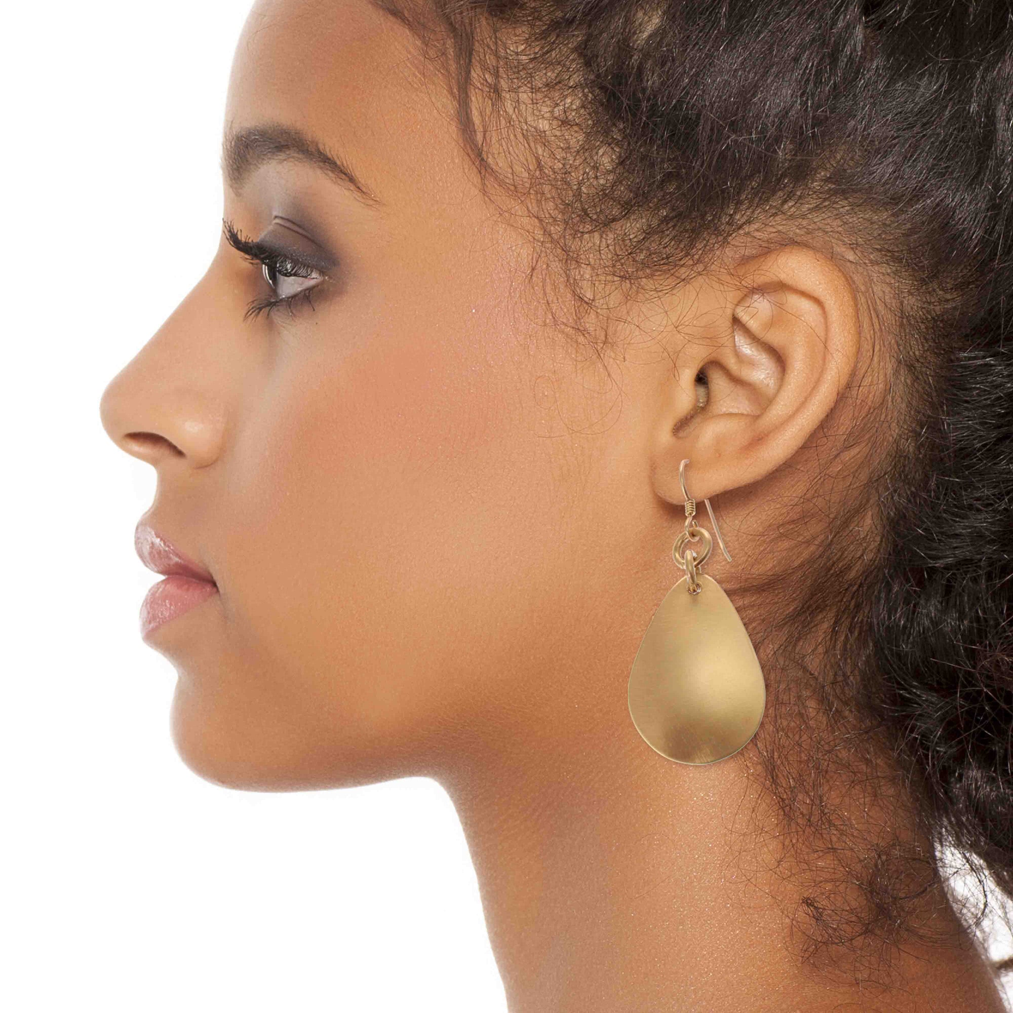 Chic Woman Wearing Brushed Bronze Medium Teardrop Earrings