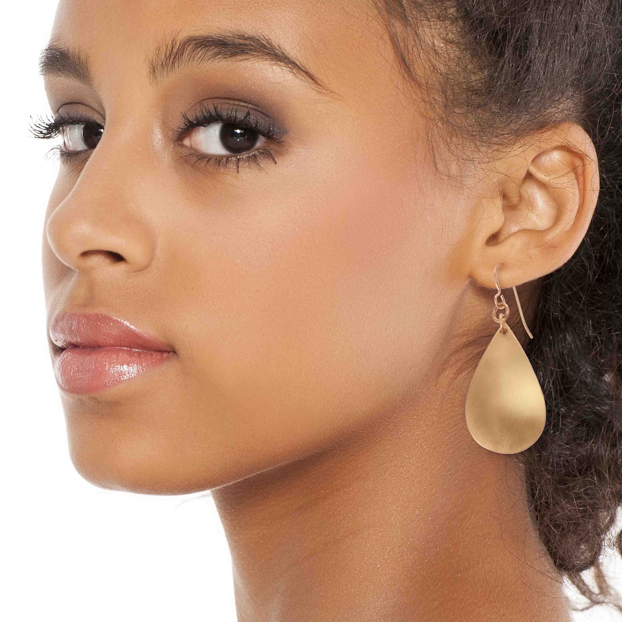 Stunning Woman Wearing Brushed Bronze Teardrop Earrings