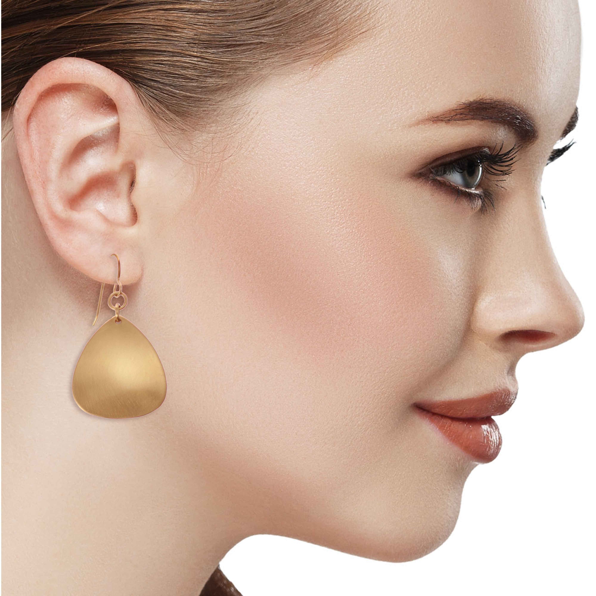 Elegant Woman Wearing Brushed Bronze Triangular Drop Earrings