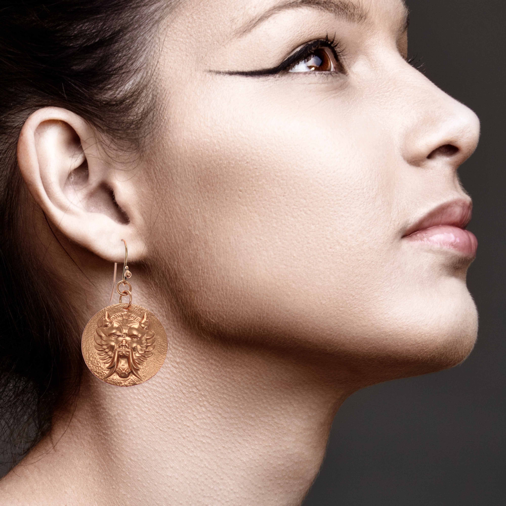 Elegant Woman Wearing Chinese Foo Dog Copper Disc Earrings