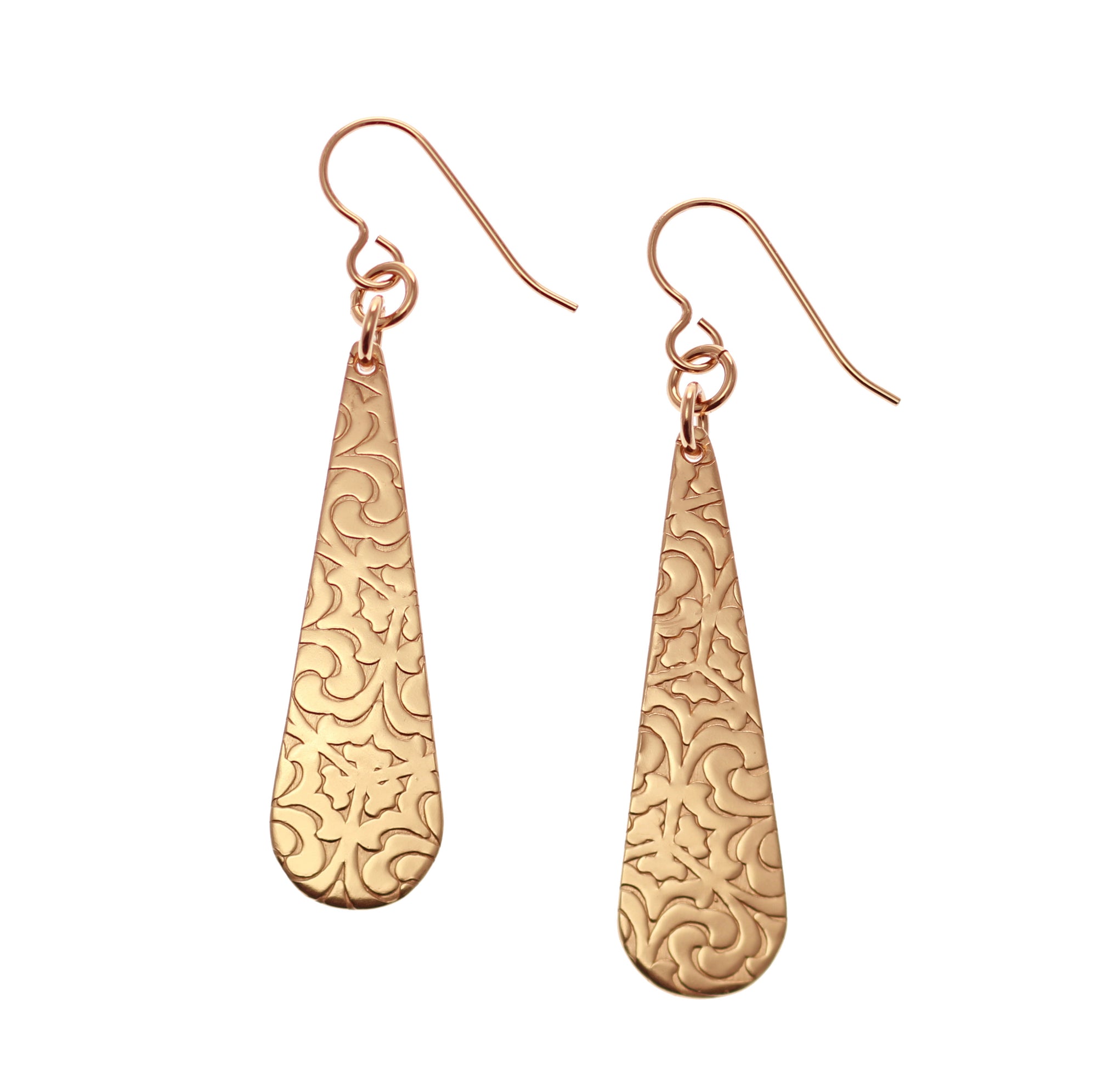 A Pair of Damask Embossed Bronze Long Teardrop Earrings on a White Background