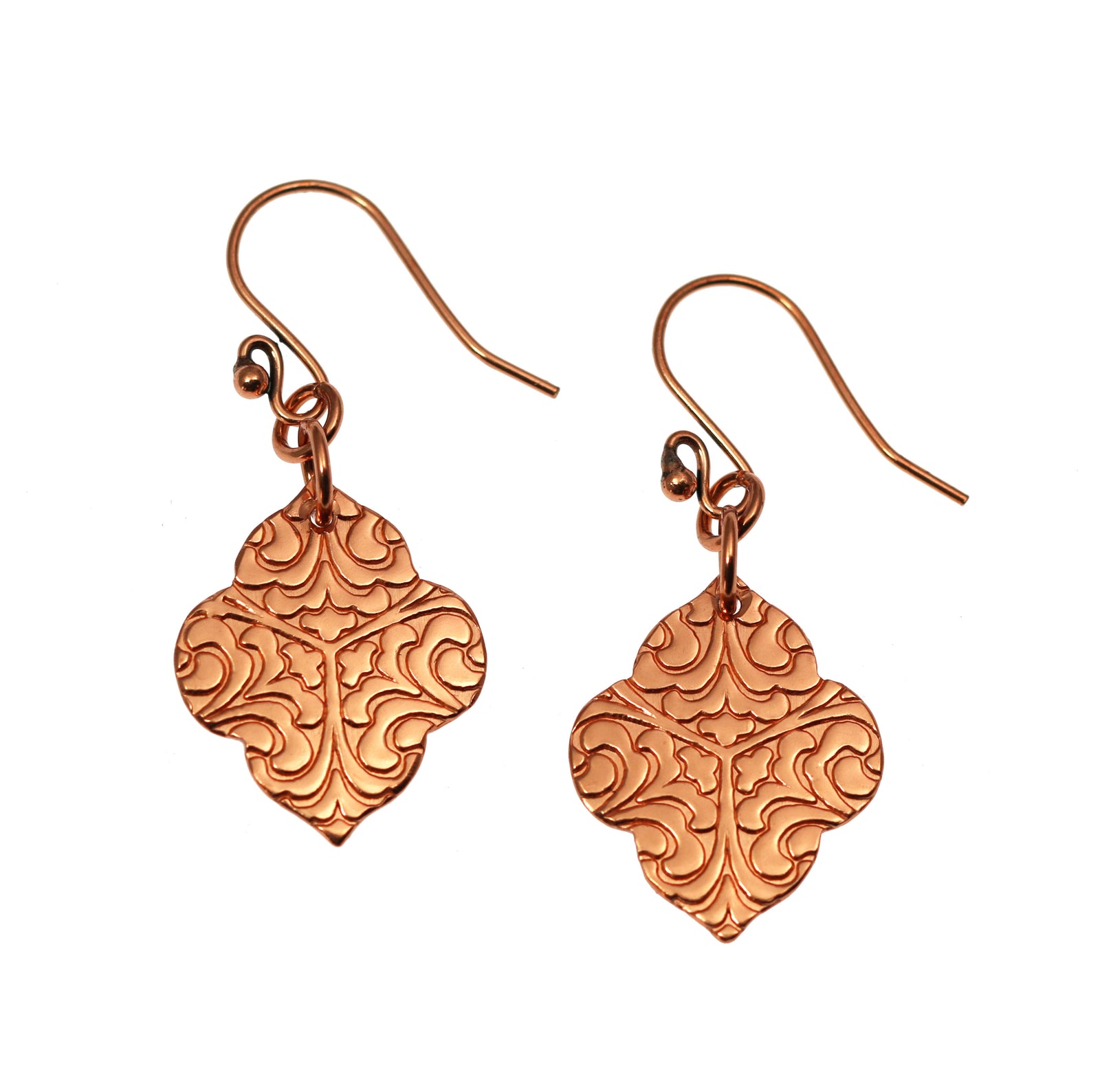 A Pair of Damask Embossed Copper Quatrefoil Drop Earrings on a White Background