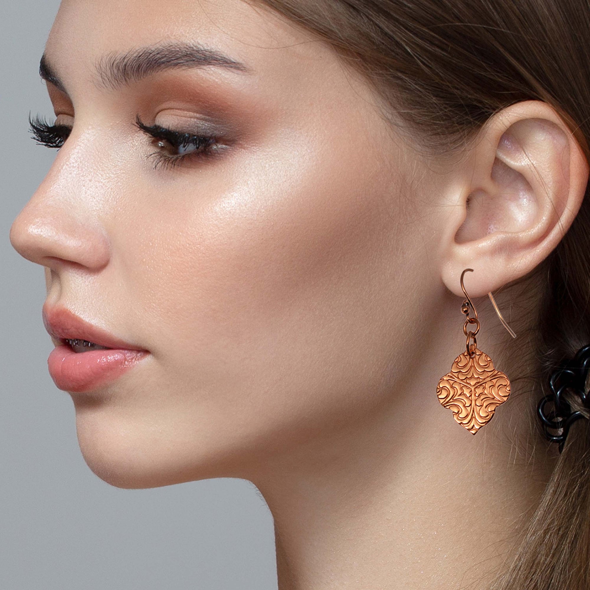 Stunning Woman Wearing Damask Embossed Copper Quatrefoil Drop Earrings