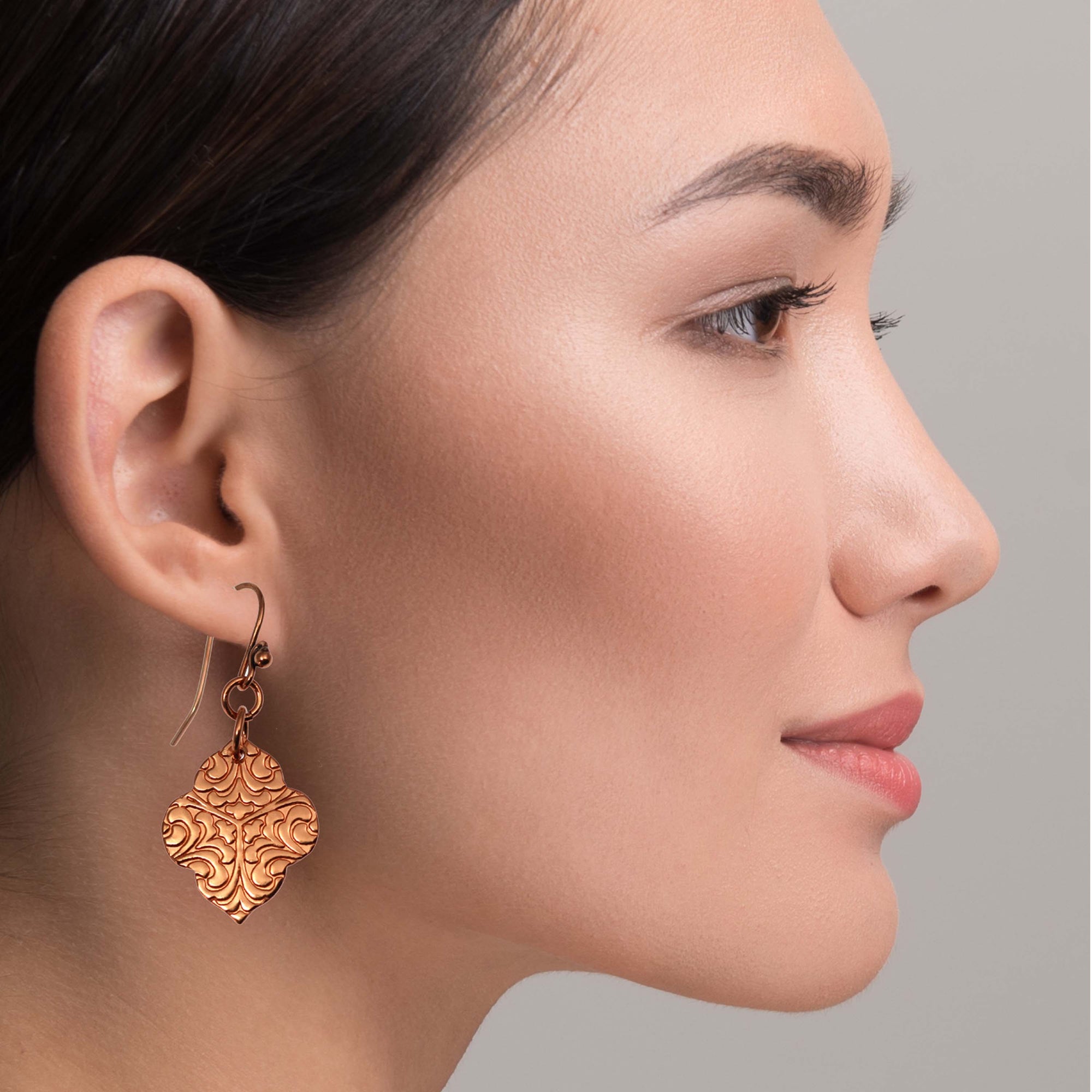 Chic Woman Wearing Damask Embossed Copper Quatrefoil Drop Earrings