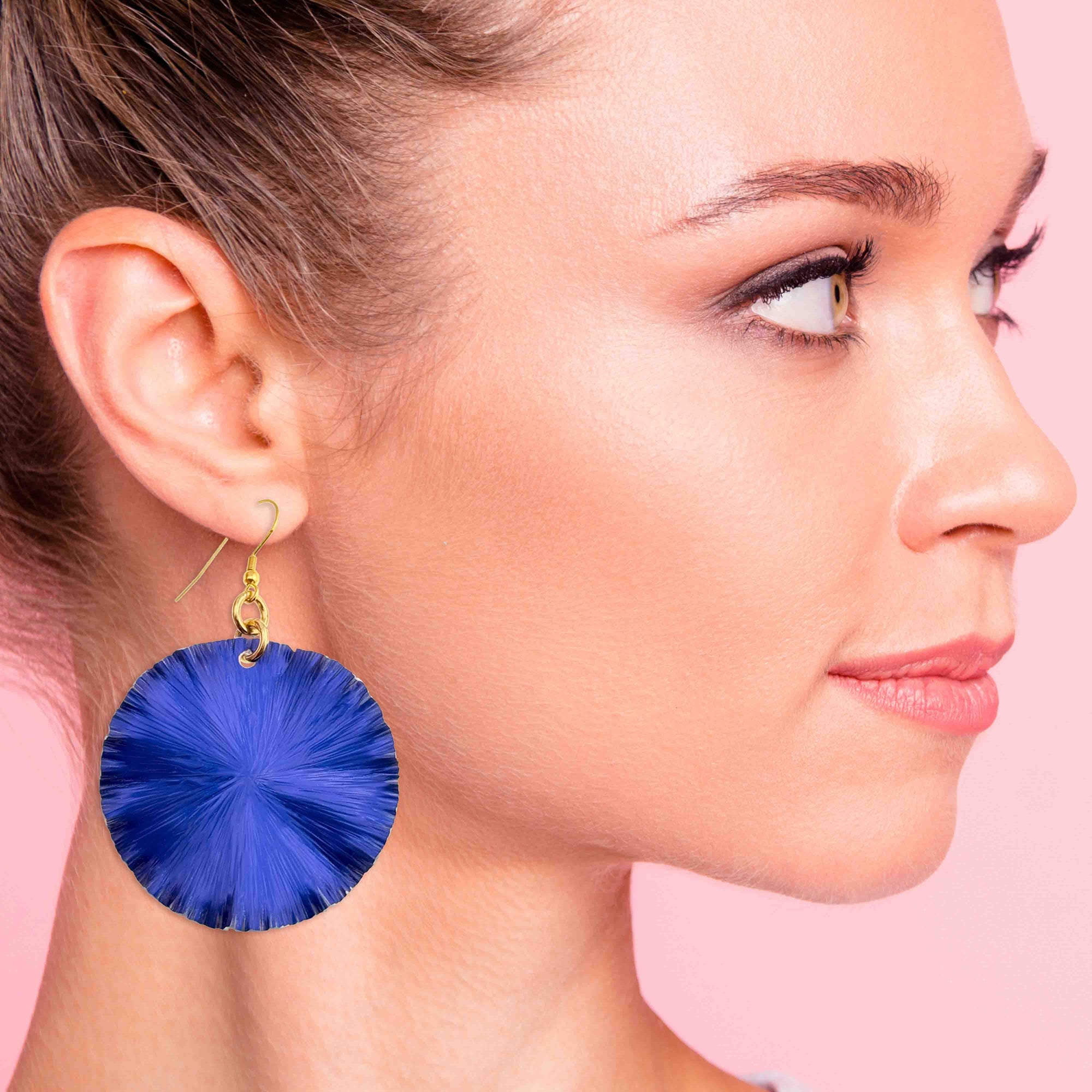 A Stylish Woman Wearing Large Cobalt Blue Lily Pad Anodized Aluminum Leaf Earrings