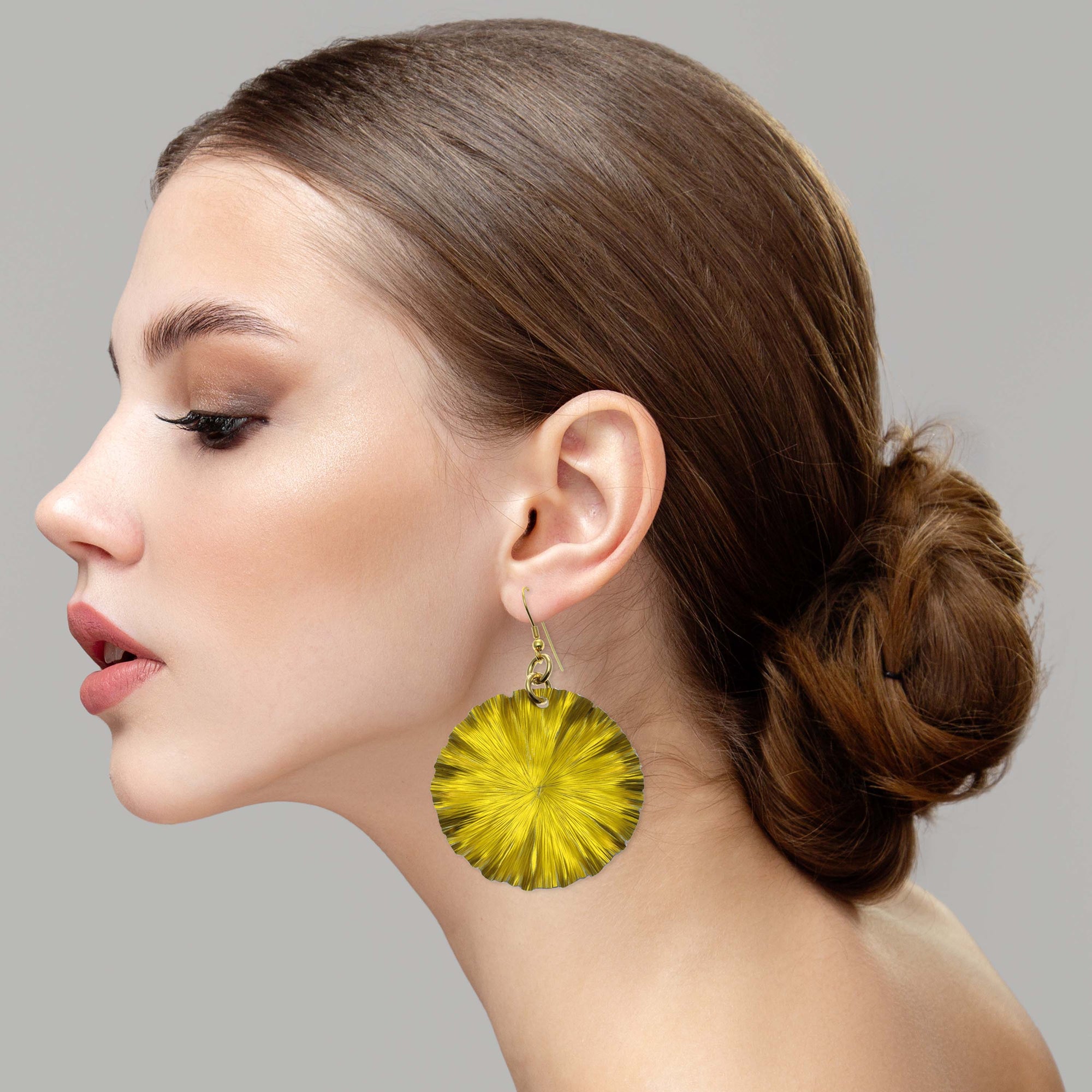 Elegant Woman Wearing Large Canary Yellow Lily Pad Anodized Aluminum Leaf Earrings