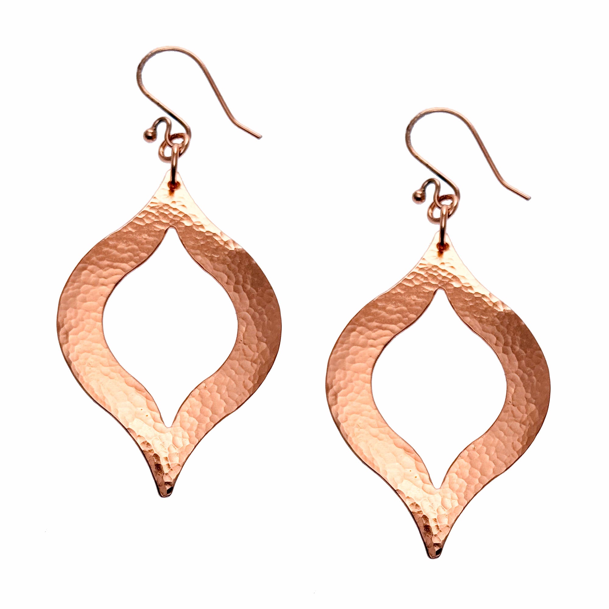 A Pair of Large Pierced Hammered Copper Marrakesh Earrings on a White Background