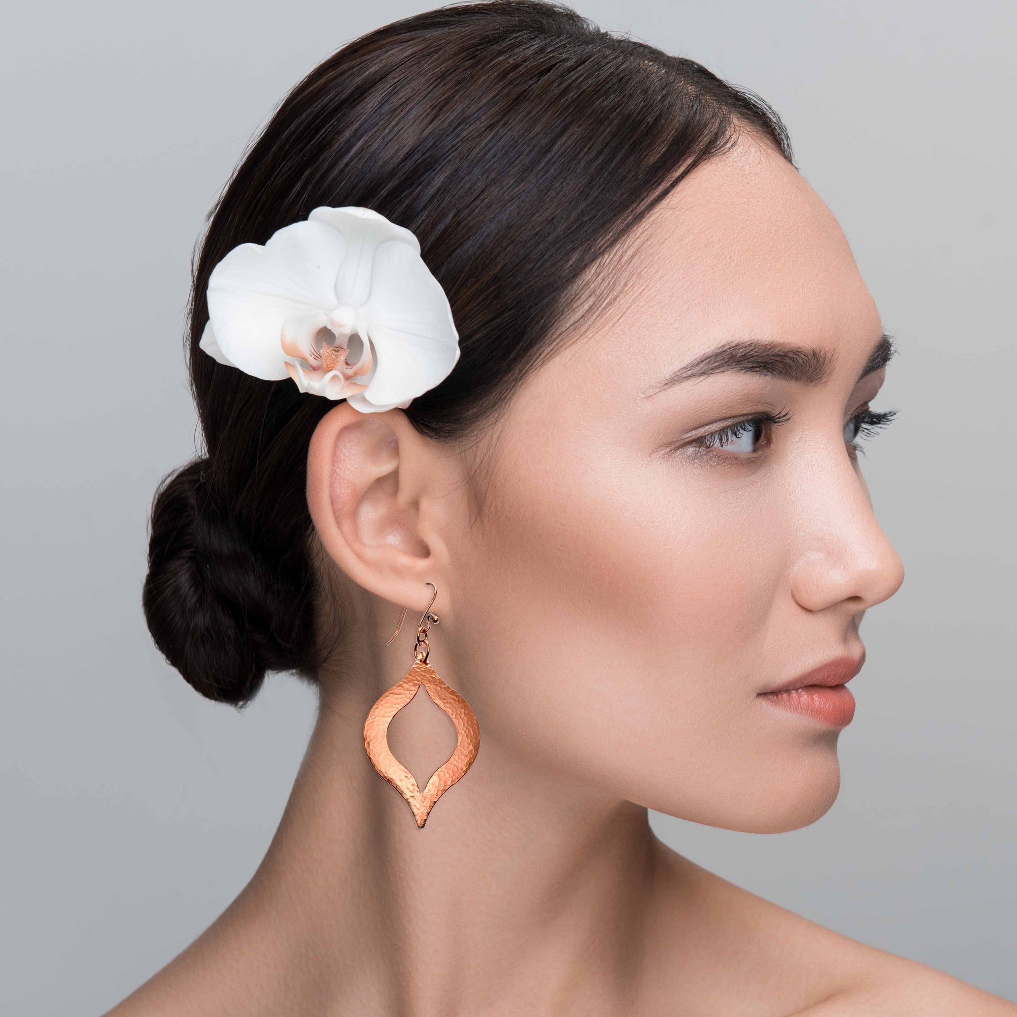 An Elegant Woman Wearing Large Pierced Hammered Copper Marrakesh Earrings