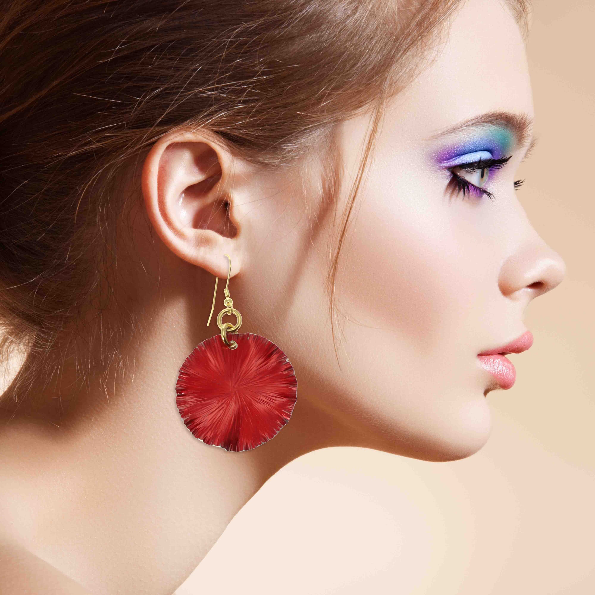 A Stylish Woman Wearing Large Red Anodized Aluminum Lily Pad Earrings