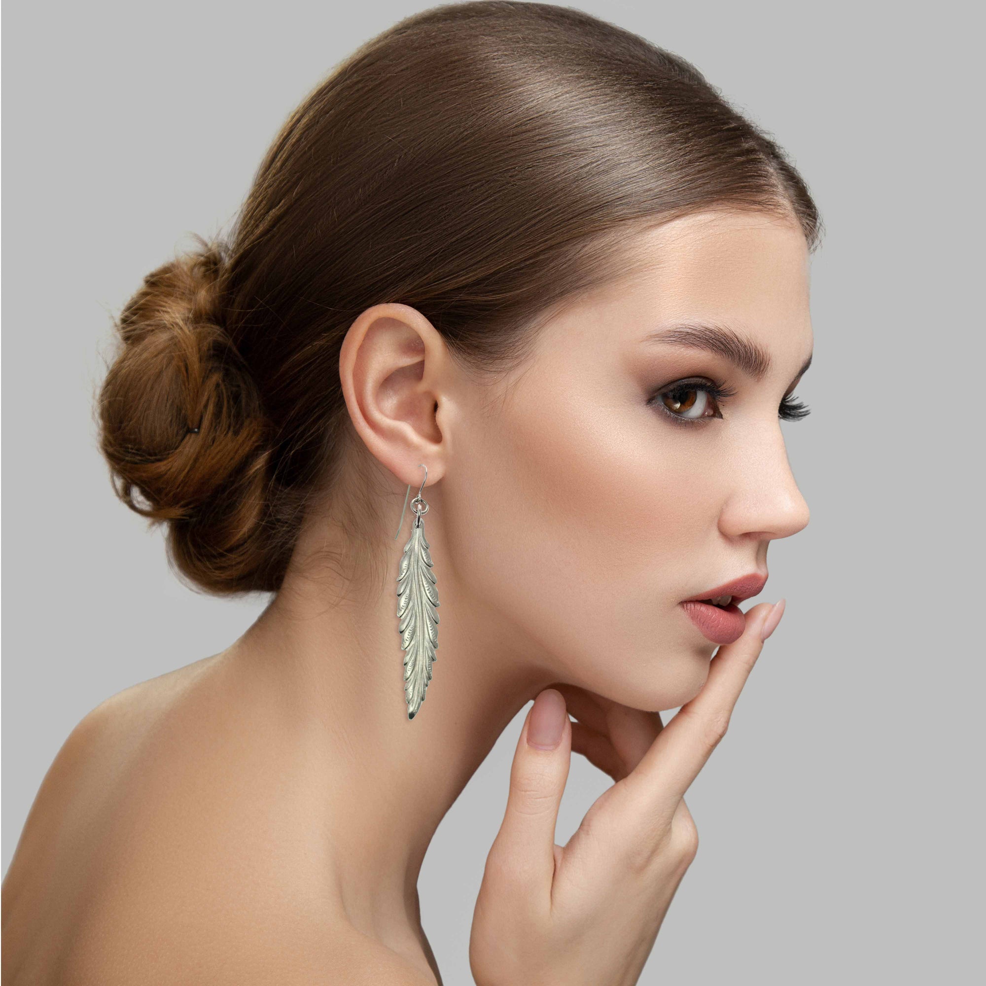 Elegant Woman Wearing Long Feather Aluminum Drop Earrings 