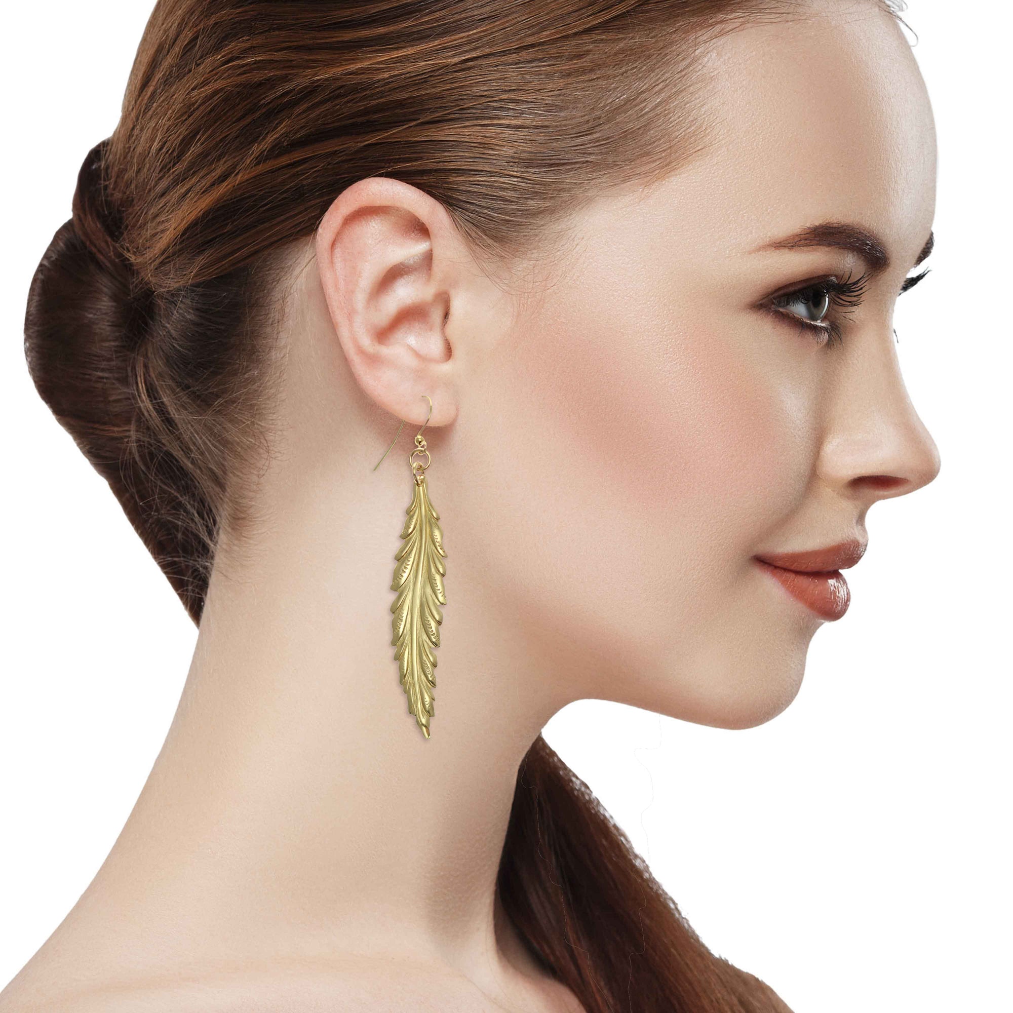 Stunning Woman with Red Hair Wearing Long Feather Brass Nu Gold Drop Earrings