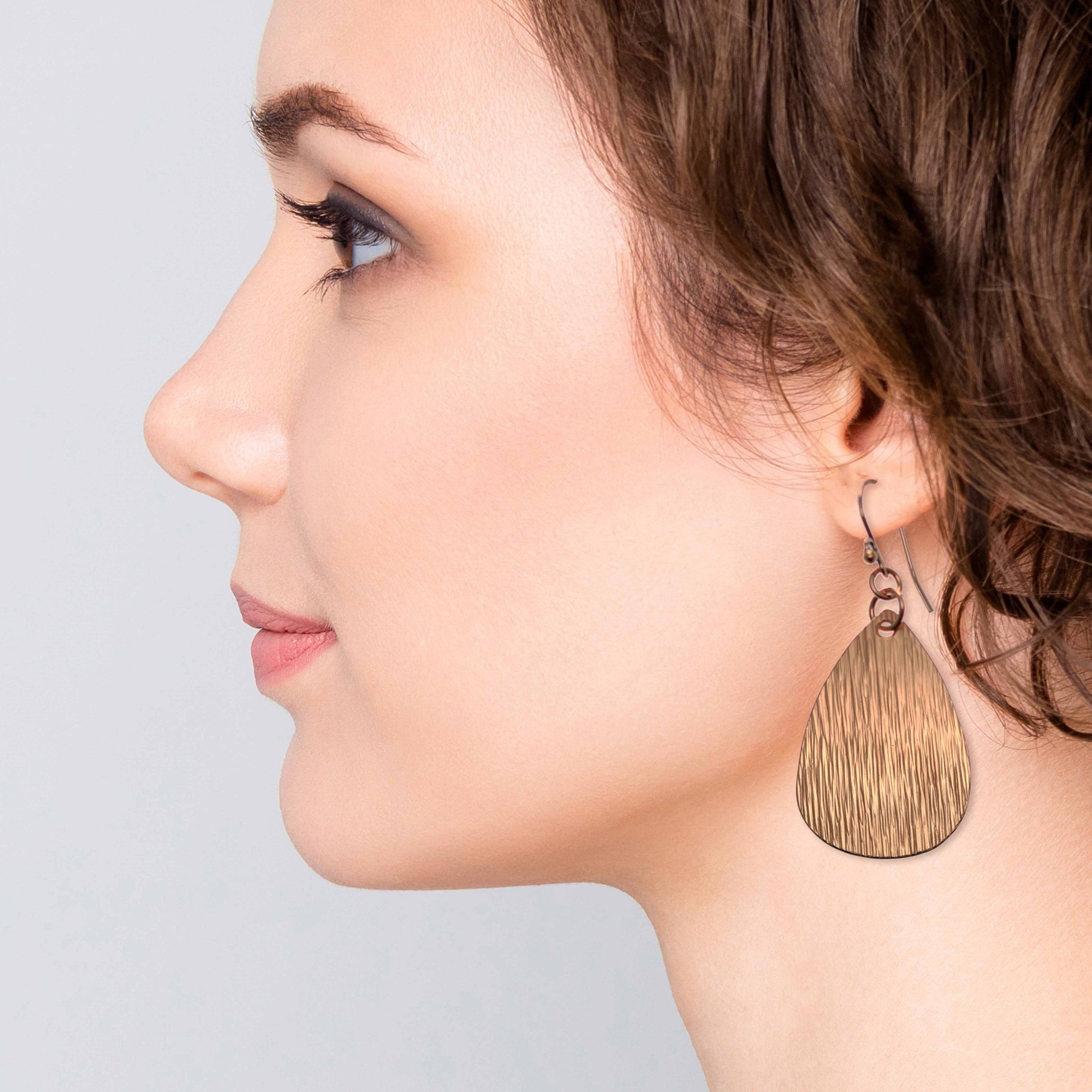 Stylish Woman Wearing Medium Bark Embossed Copper Teardrop Earrings