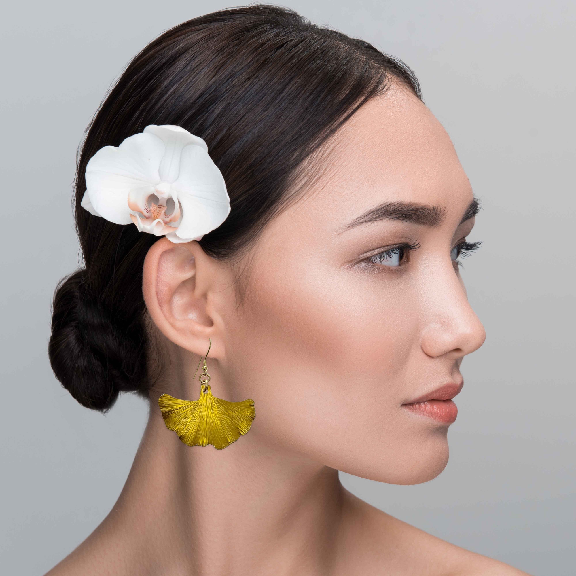 An Elegant Woman Wearing Medium Canary Yellow Anodized Ginkgo Leaf Earrings