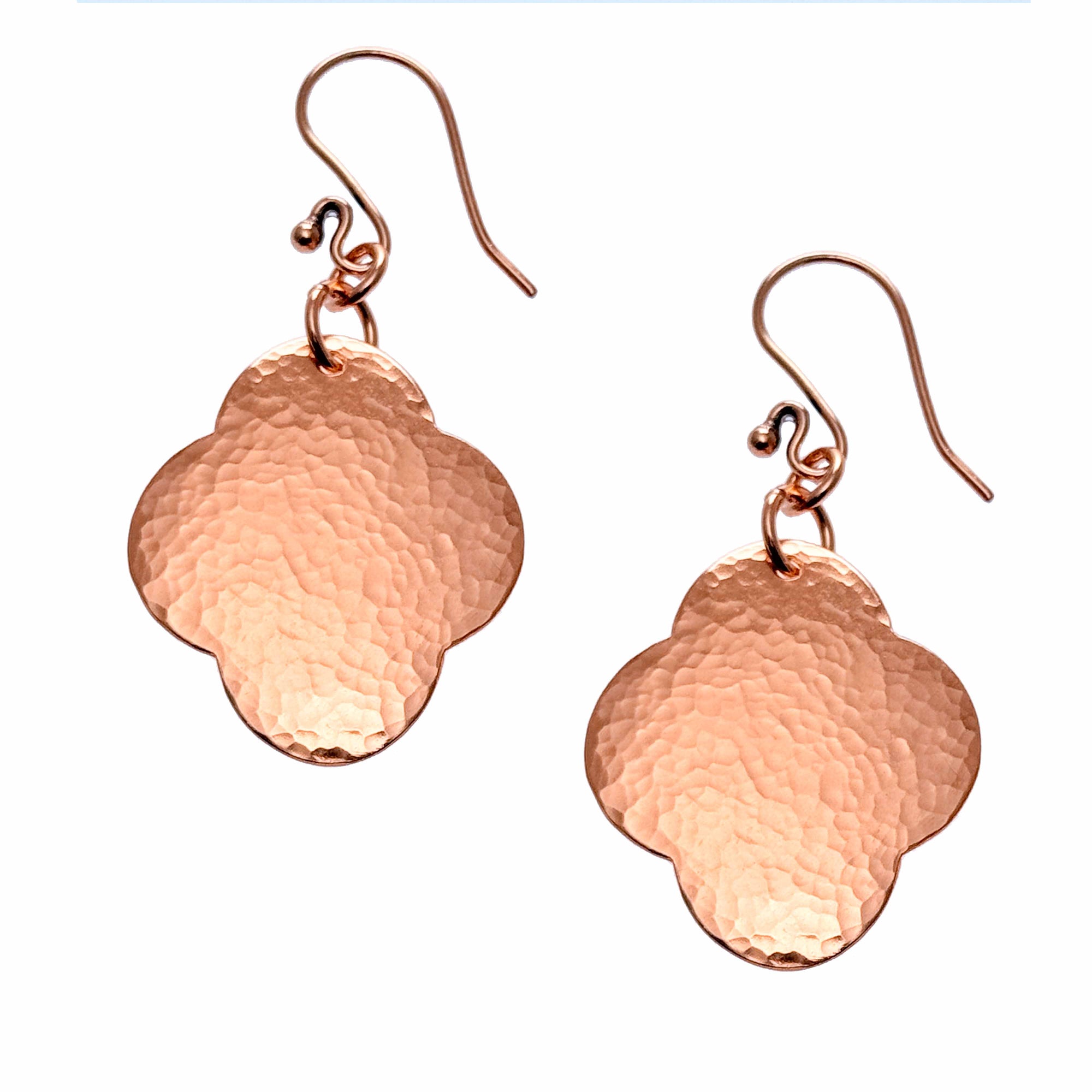 A Pair of Medium Hammered Copper Clover Drop Earrings on a White Background