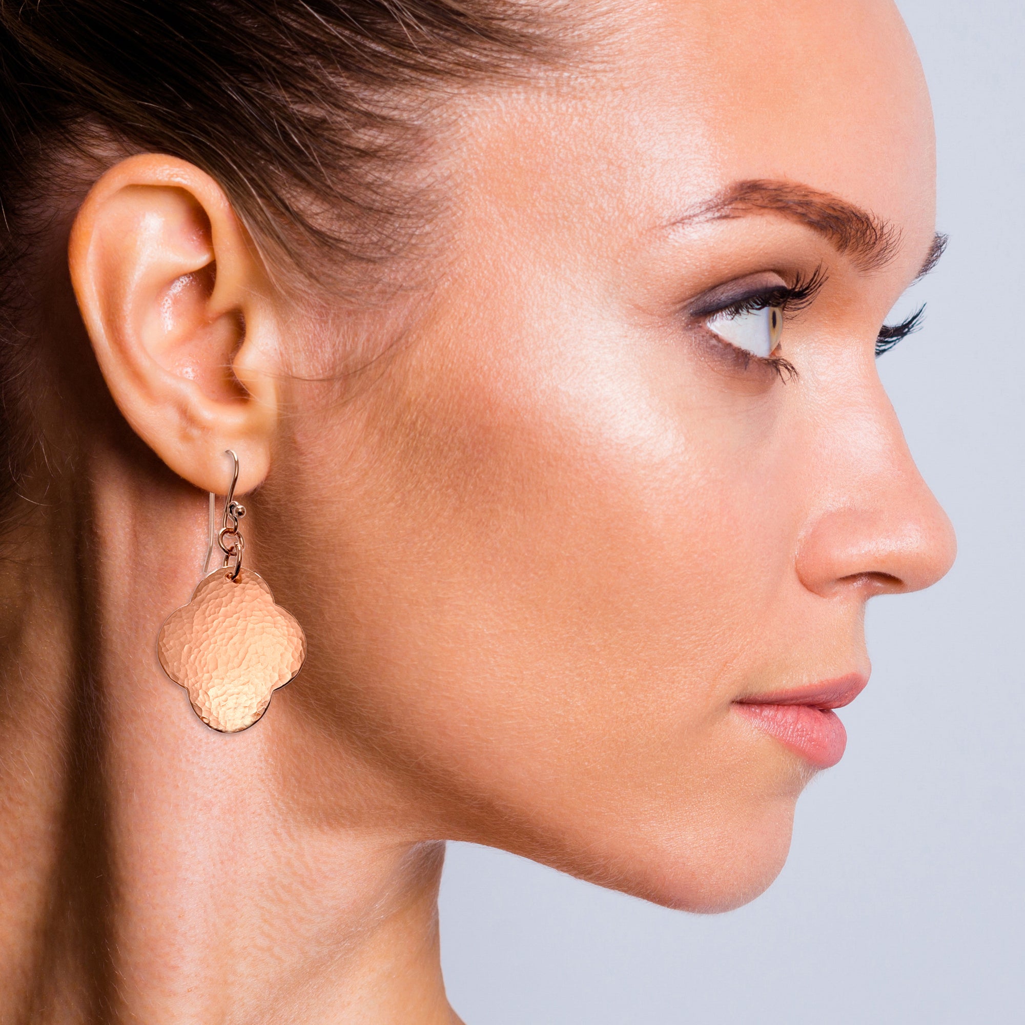 A Stunning Woman Wearing Medium Hammered Copper Clover Drop Earrings