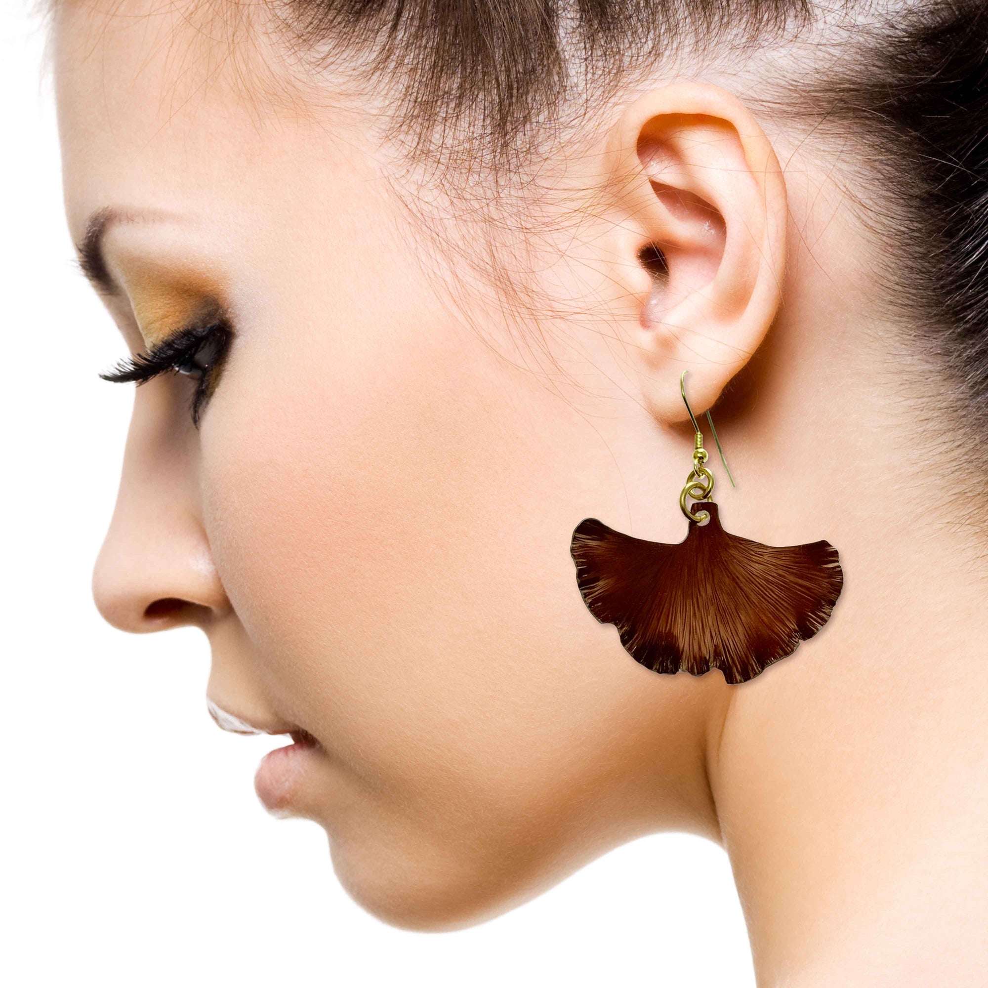 An Elegant Woman Wearing Medium Henna Brown Anodized Ginkgo Leaf Earrings