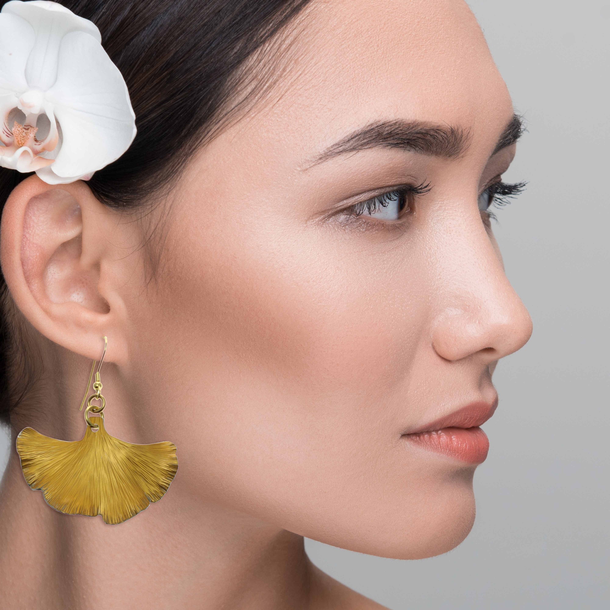 Elegant Woman Wearing Medium Light Orange Anodized Ginkgo Leaf Drop Earrings