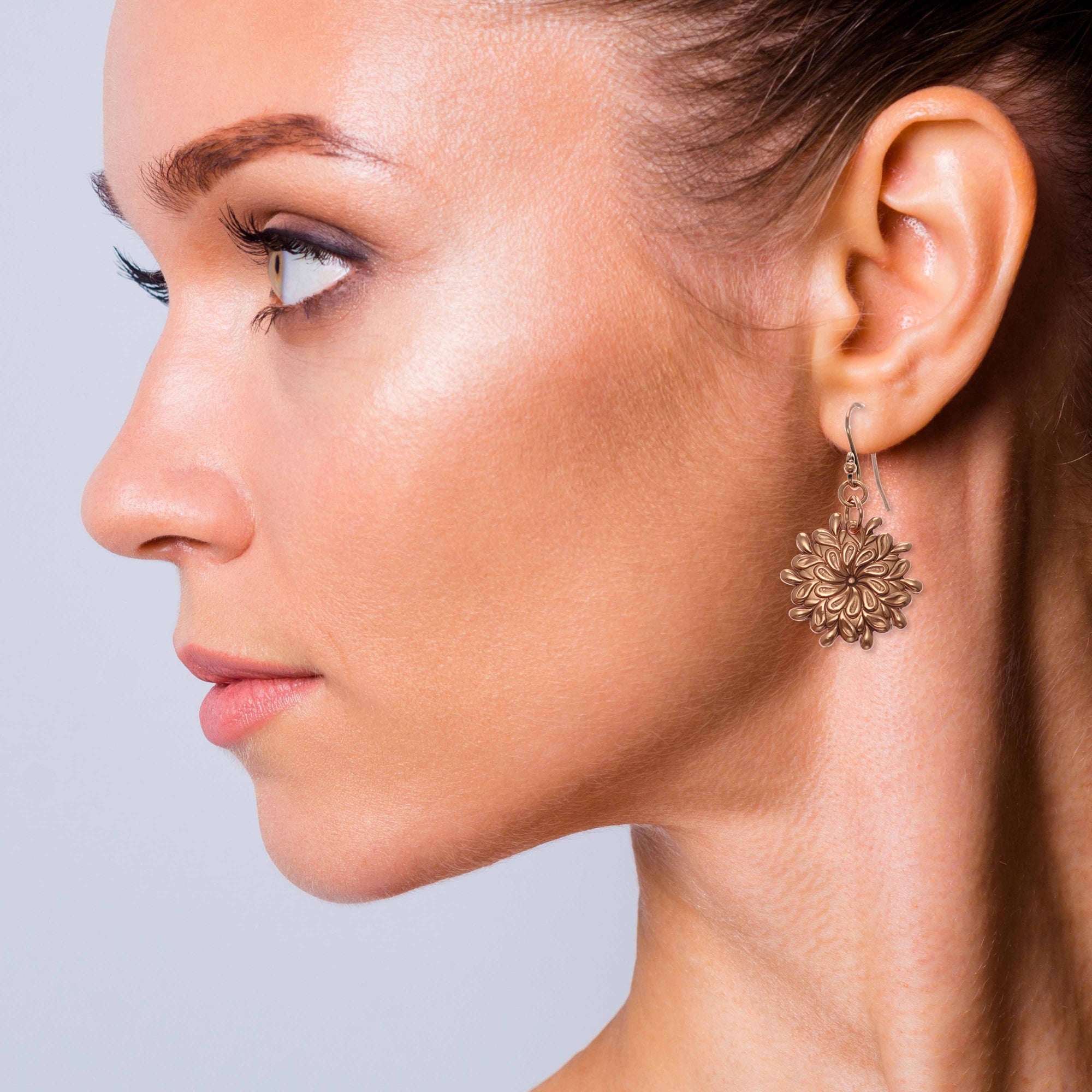 Fashionable Woman Wearing Paisley Burst Copper Drop Earrings