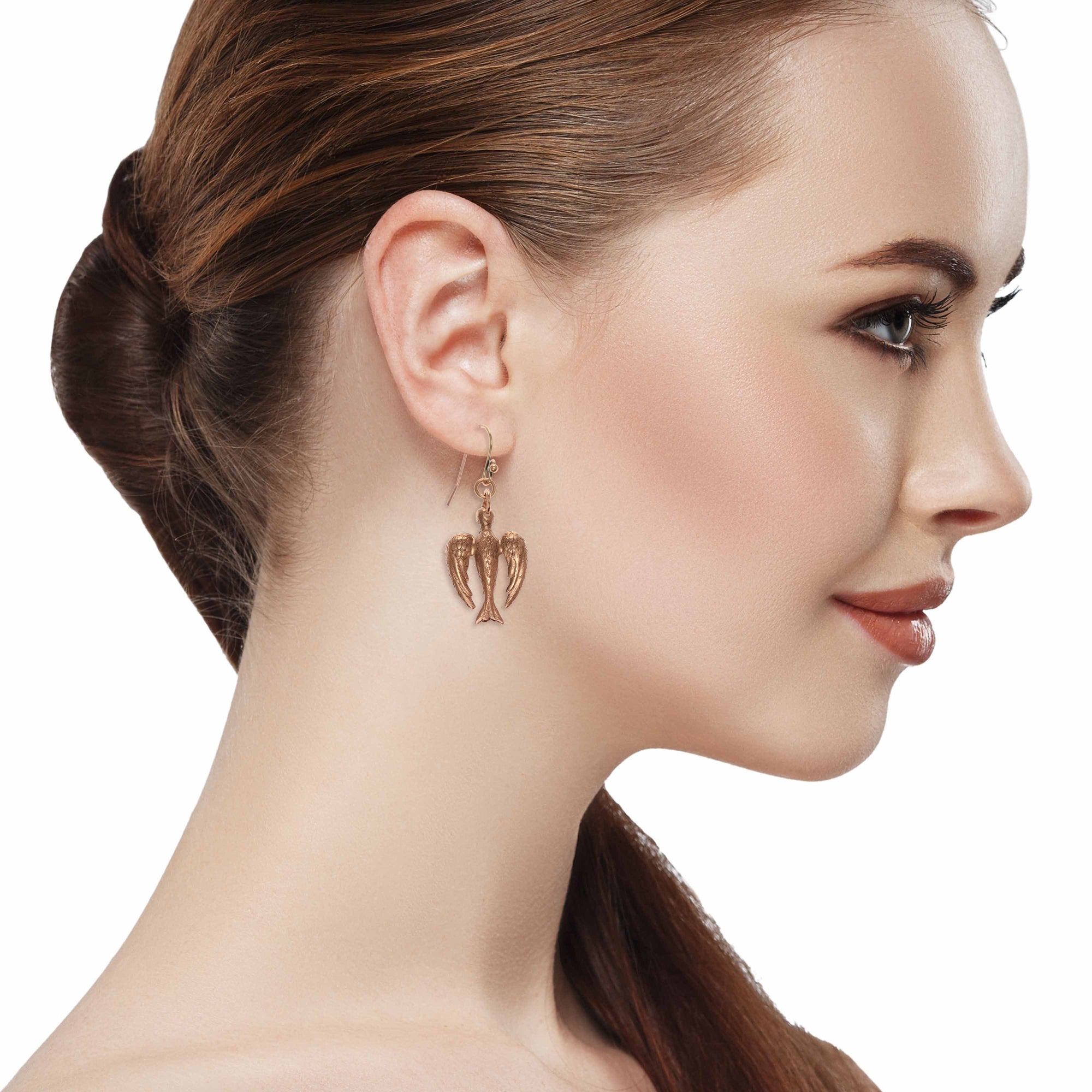 Stunning Redhead Woman Wearing Peace Dove Copper Drop Earrings