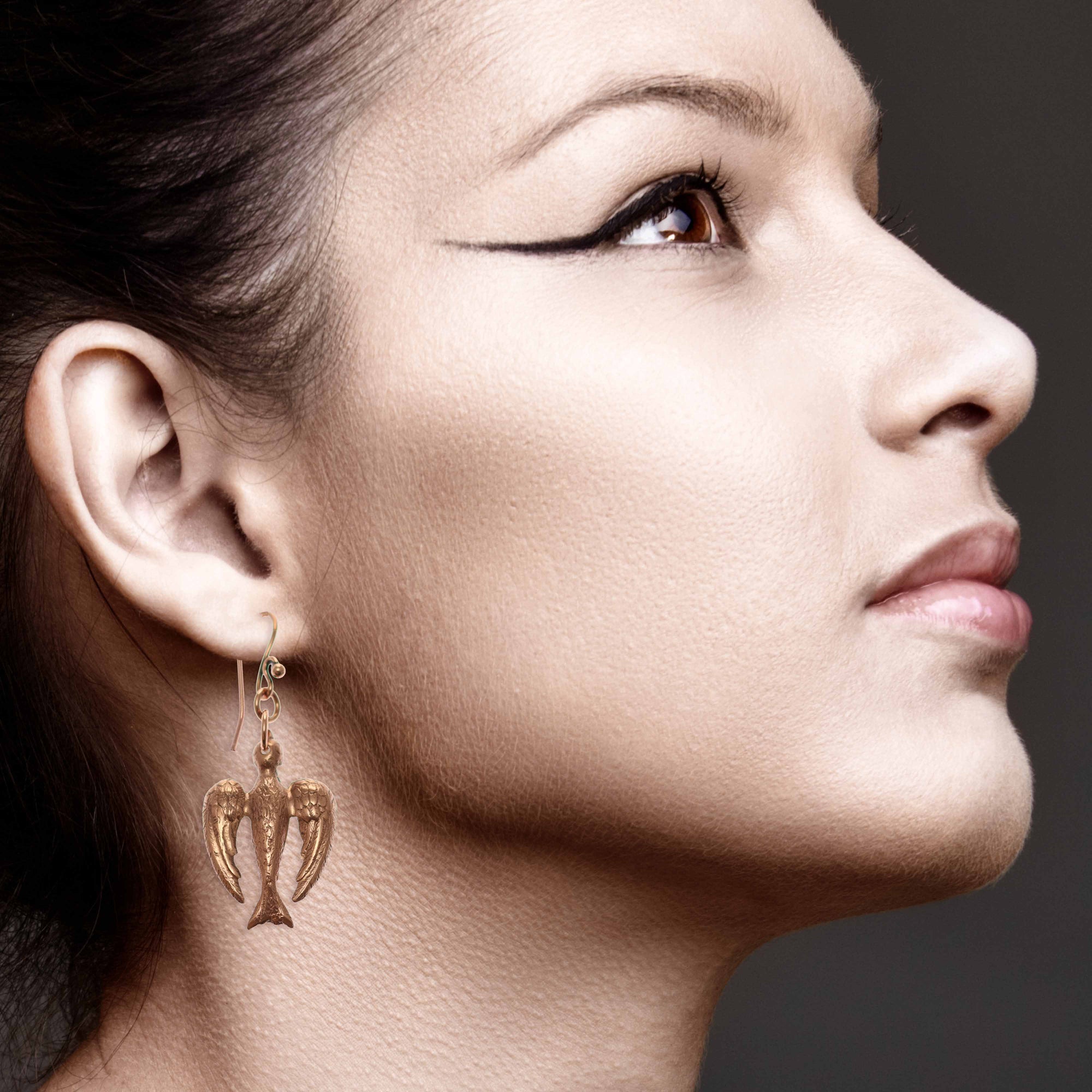 Elegant Woman Wearing Peace Dove Copper Drop Earrings