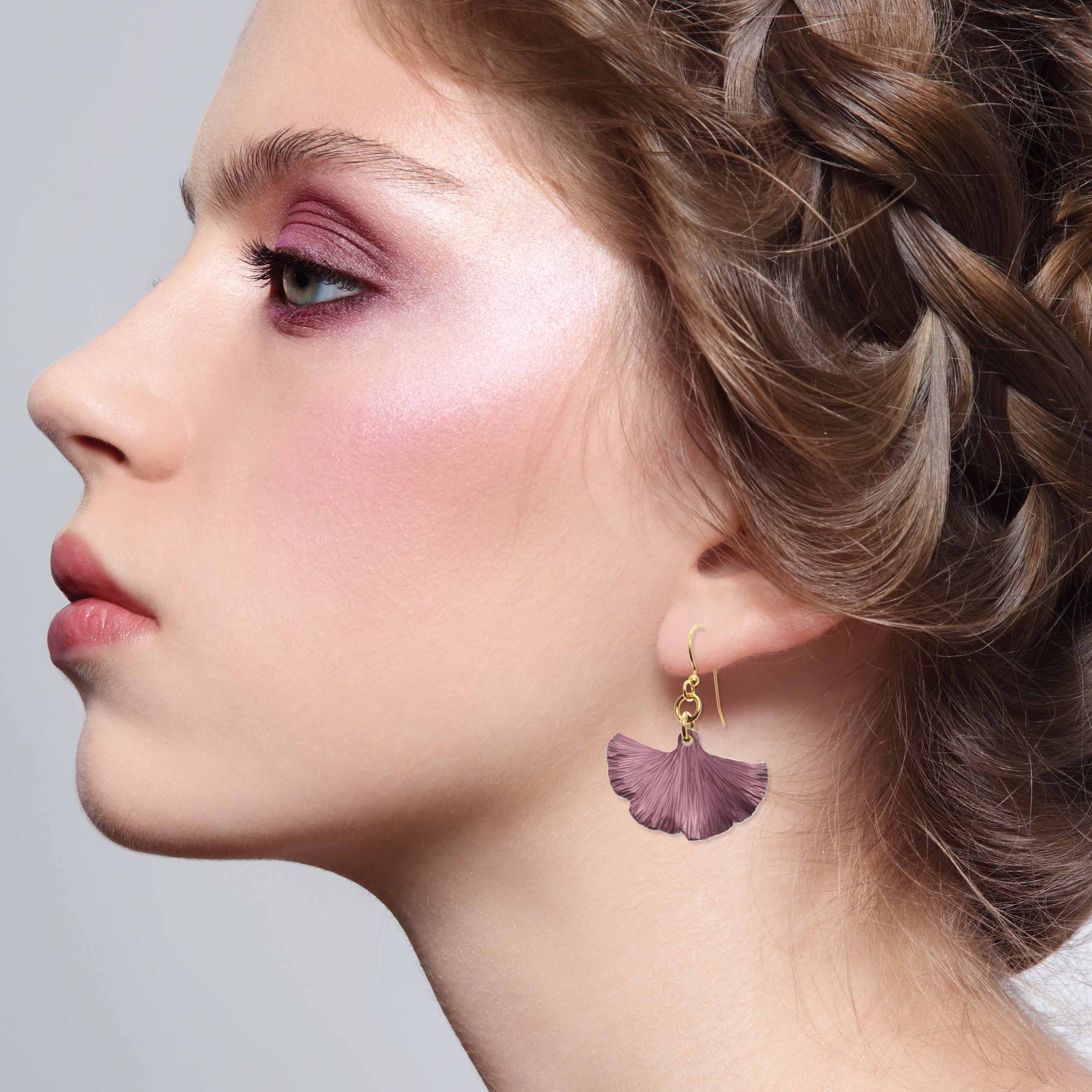 Stunning Woman Wearing Small Mauve Ginkgo Leaf Anodized Aluminum Purple Earrings