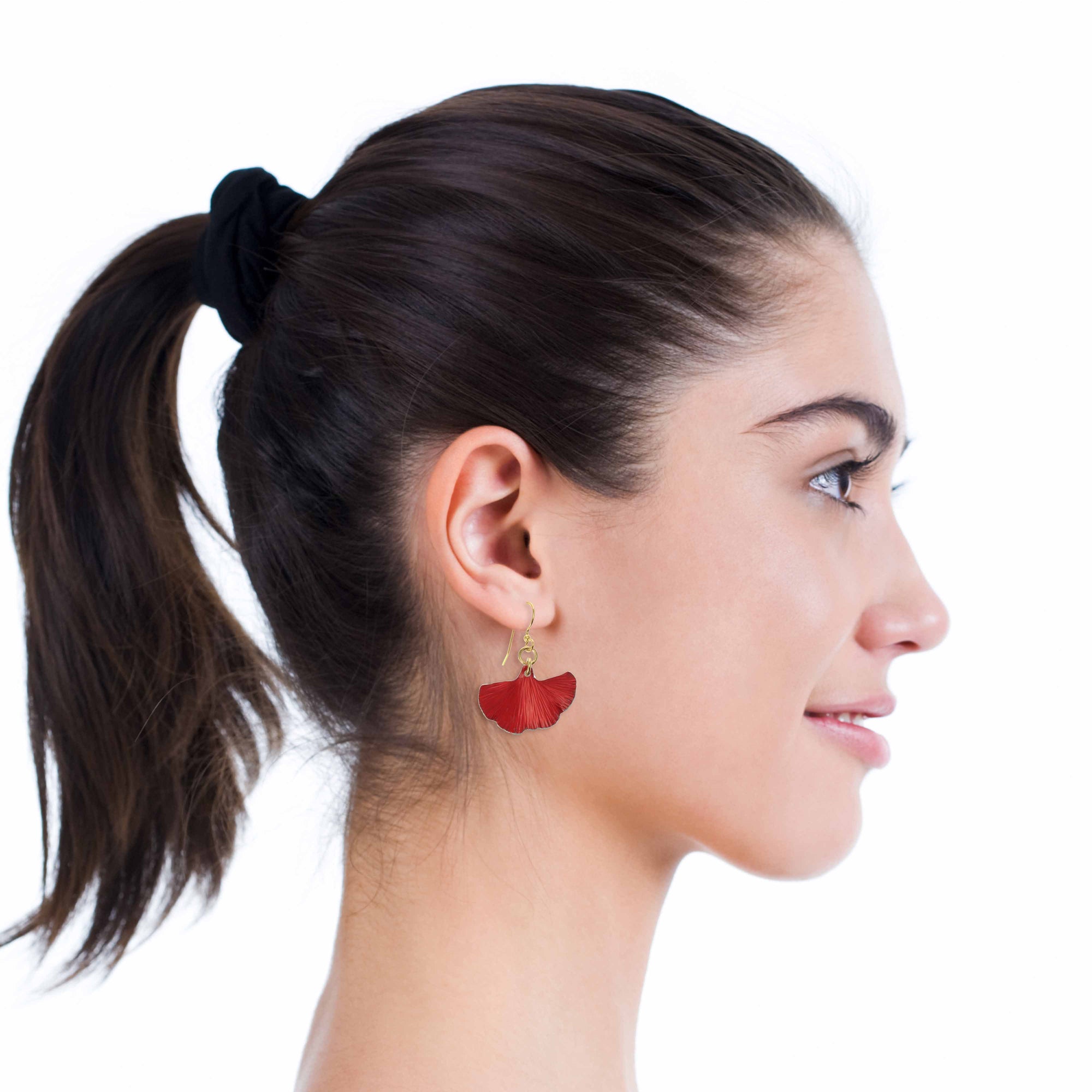 A Chic Woman WIth a Ponytail Wearing Small Red Ginkgo Leaf Anodized Aluminum Earrings 