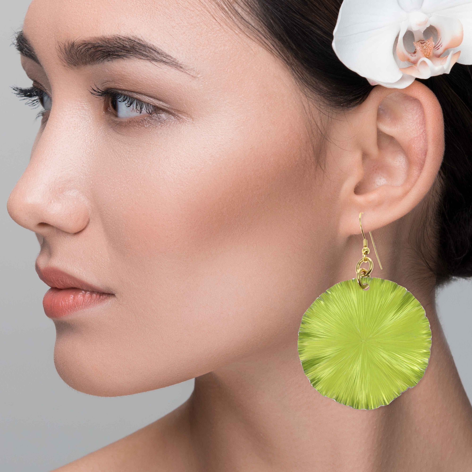 An Elegant Woman Wearing Sour Candy Apple Anodized Aluminum Large Lily Pad Earrings