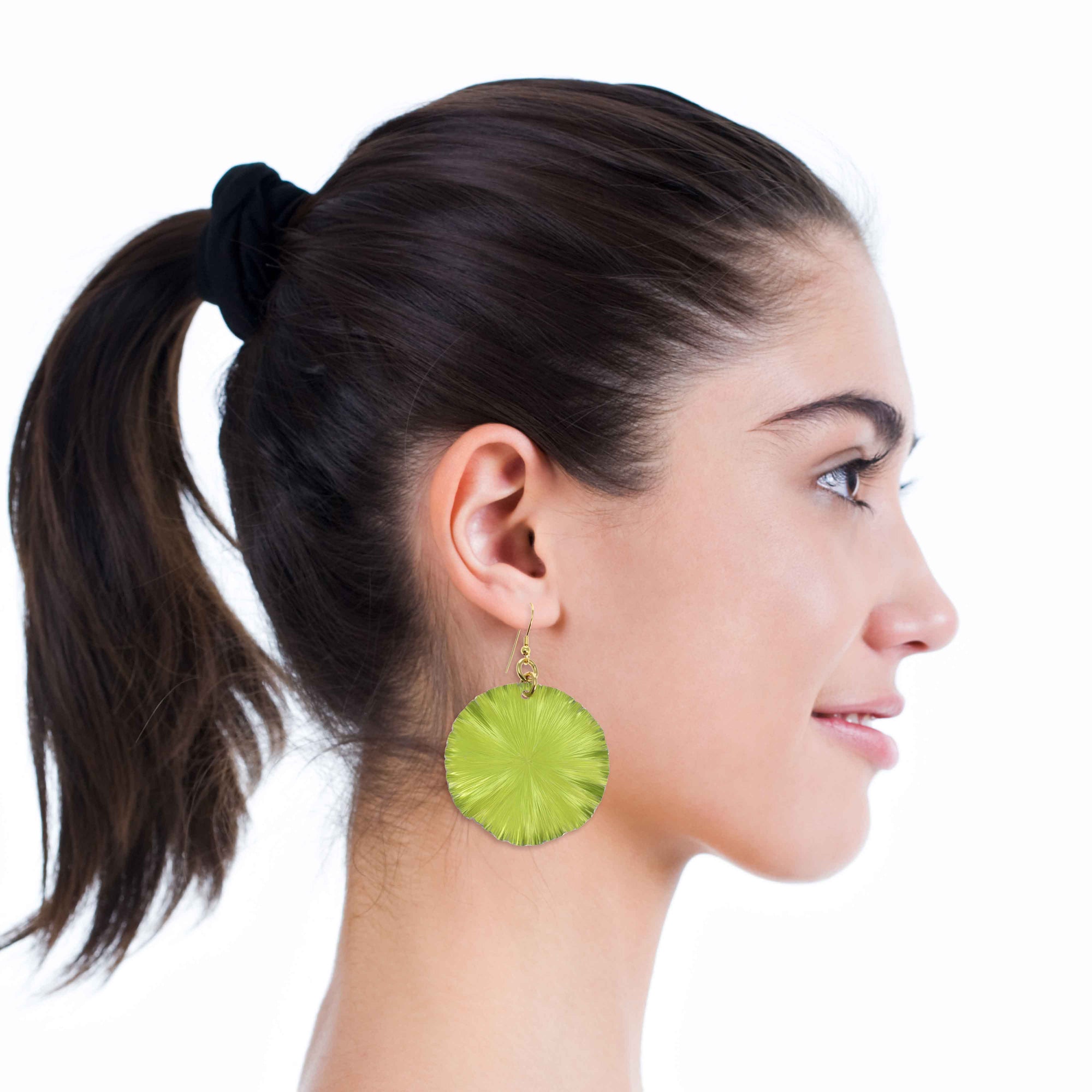 A Chic Woman Wearing Sour Candy Apple Anodized Aluminum Large Lily Pad Earrings