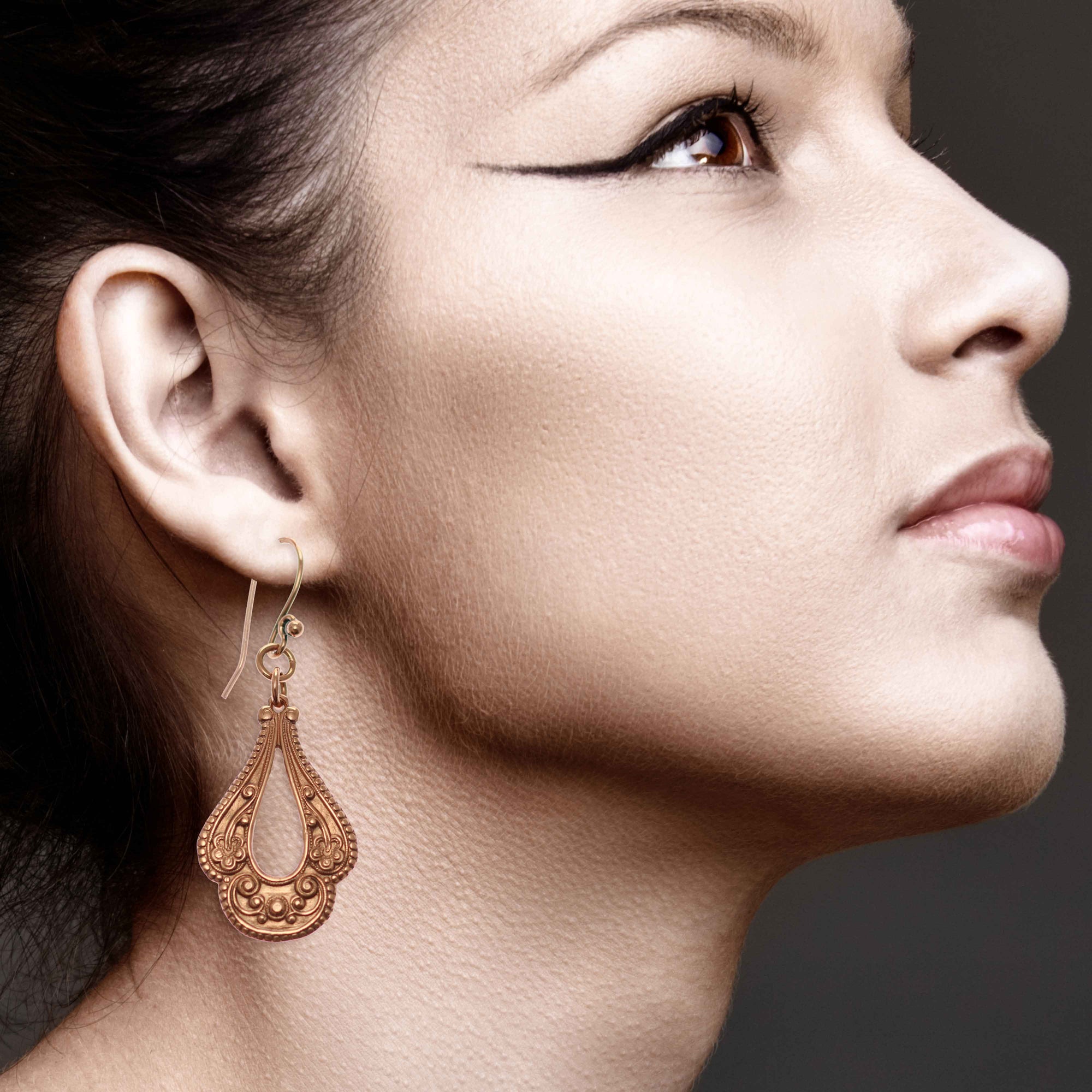 Close up of Elegant Woman Wearing Victorian Open Teardrop Earrings