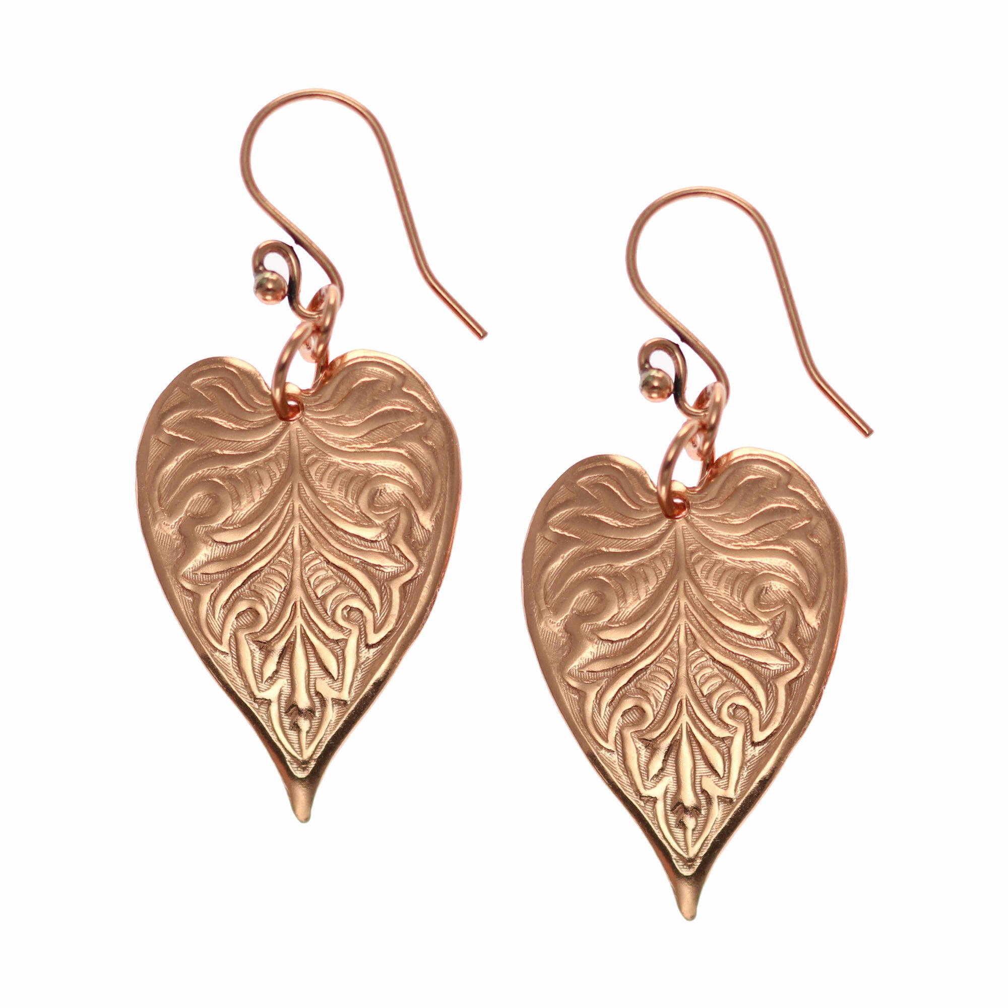 A Pair of Victorian Copper Heart Leaf Drop Earrings on a White Background